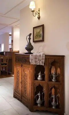 a wooden cabinet in a room with vases on it at Hotel Sari Konak in Istanbul