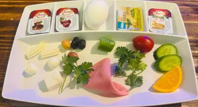 a tray of food with vegetables and other ingredients at Sultan Hostel & Guesthouse in Istanbul