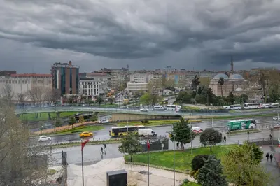 a city with buses and cars on a highway at Hotel Melita in Istanbul