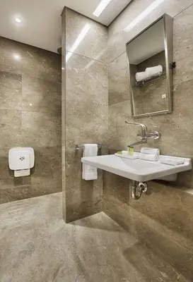 a bathroom with a sink and a mirror at DoubleTree by Hilton Istanbul-Avcilar in Istanbul