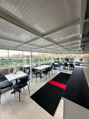 a dining room with tables and chairs and windows at Bade Boutique Hotel Kadıköy in Istanbul