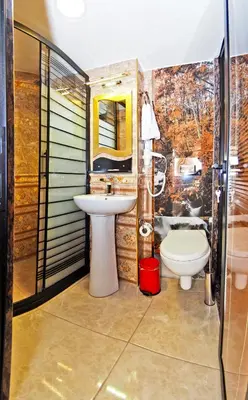 a bathroom with a sink and a toilet at Glamour Classic Hotel Istanbul Sirkeci in Istanbul