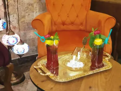 a table with two drinks on a tray on a chair at Boss Hotel Sultanahmet in Istanbul