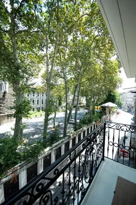 a balcony with a view of a street and trees at Boss Hotel Sultanahmet in Istanbul