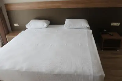 a large white bed with two pillows on it at Longoz Hotel in Igneada