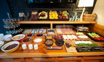 a table with many different types of food on it at Nomade Hotel Exclusive in Istanbul