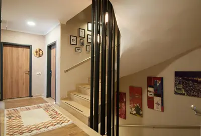 a hallway with stairs and a door with a rug at Nomade Hotel Exclusive in Istanbul