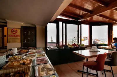 a buffet line with plates of food in a restaurant at Mevlana Hotel in Istanbul