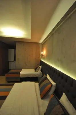 a hotel room with two beds and a wall at Retropera Hotel in Istanbul
