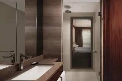 a bathroom with a sink and a mirror at Sheraton Istanbul City Center in Istanbul