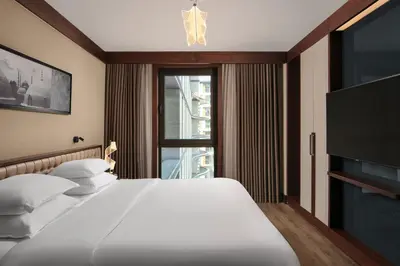 a bedroom with a large bed and a television at Sheraton Istanbul City Center in Istanbul