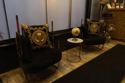 a living room with two chairs and a table at Florya House Hotel in Istanbul