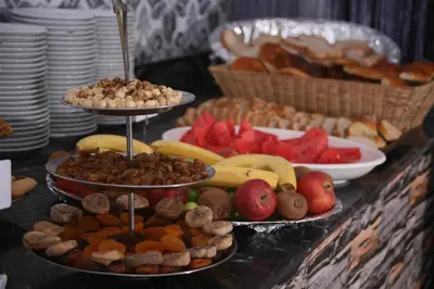 a table with three tiers of different types of food at Formback Thermal Suit & Apart in Bursa