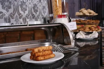 a plate of food on a counter in a bakery at Formback Thermal Suit & Apart in Bursa