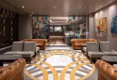 a waiting room with leather chairs and a carpet at Windsor Hotel & Convention Center Istanbul in Istanbul