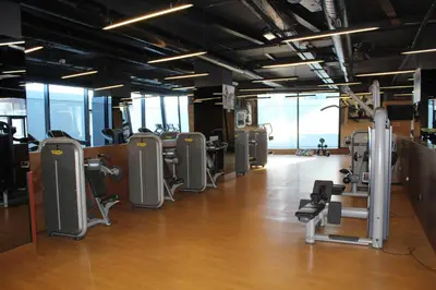 a gym with several treadmills and exercise equipment at Windsor Hotel & Convention Center Istanbul in Istanbul