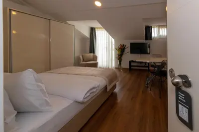 a hotel room with a bed and a television at Joy Suites in Istanbul