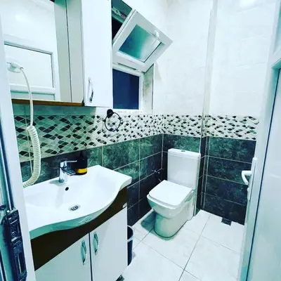 a bathroom with a toilet and a sink at donat suites apartment in Istanbul