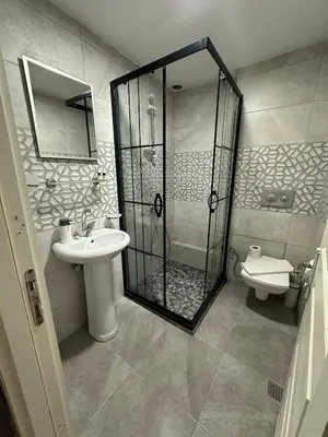a bathroom with a shower and a sink and a toilet at Hotel Estambul in Istanbul