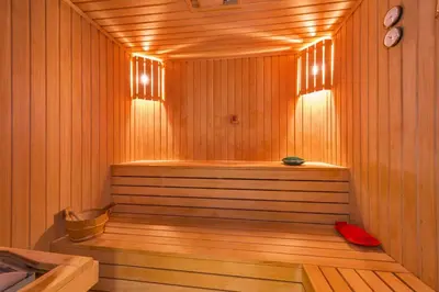 a wooden sauna with a wooden floor and a tub at The Meretto Hotel Istanbul Old City in Istanbul