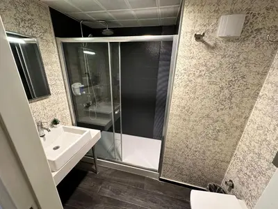a bathroom with a shower and a sink at Tempo Hotel Caglayan in Istanbul