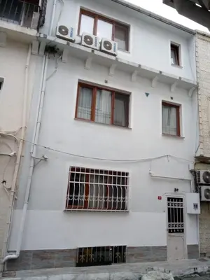 a white building with a sign on it at SUFI APART Otel in Istanbul