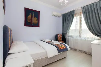 a bedroom with a bed and a window at SUFI APART Otel in Istanbul
