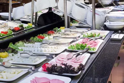 a buffet line with many plates of food at Meretto Hotel LALELİ in Istanbul