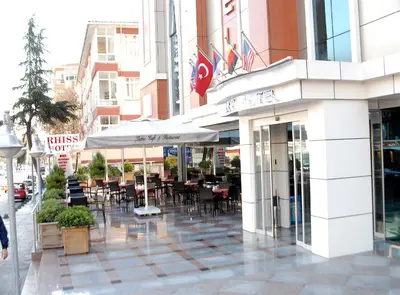a restaurant with tables and chairs outside of a building at Rhiss Hotel Bostanci in Istanbul