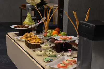 a buffet with plates of food on a table at Rhiss Hotel Bostanci in Istanbul