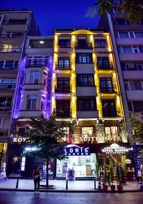a tall building with lights in front of it at Royal Garden Suite and Hotel in Istanbul