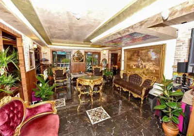 a living room filled with furniture and a table at Royal Garden Suite and Hotel in Istanbul