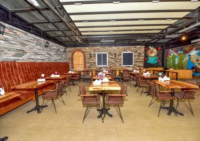 a dining room with wooden tables and chairs at Royal Garden Suite and Hotel in Istanbul