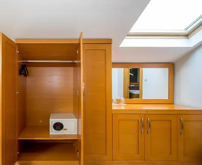 a room with wooden cabinets and a skylight at My Rose Hotel in Istanbul