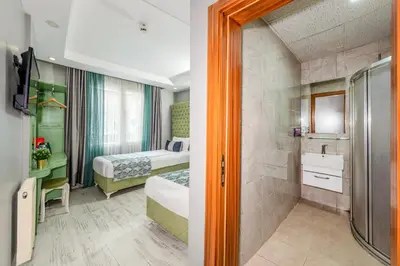 a hotel room with a bed and a bathroom at Green Garden Hotel - Bahçelievler in Istanbul