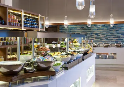 a buffet line with bowls of food in a restaurant at Elite World Grand Istanbul Küçükyalı in Istanbul