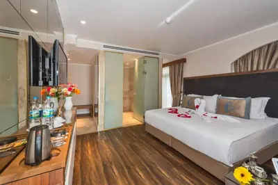 a hotel room with a large bed with flowers on it at Darkmen Hotel in Istanbul