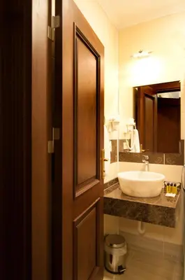 a bathroom with a sink and a mirror at Akbiyik Suite Boutique Hotel in Istanbul