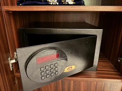 a microwave oven with a thermometer in it on a shelf at Hotel Bulvar Istanbul in Istanbul