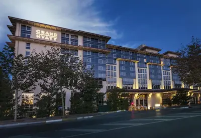 a building with a sign that reads grand await at Grand Hyatt Istanbul in Istanbul