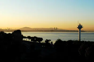 a control tower next to a body of water at Seahouse Suites in Istanbul