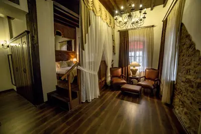 a room with a bed and a bedroom with a bedsenalsenalsenalsenalsenal at Panderma Port Hotel in Bandırma