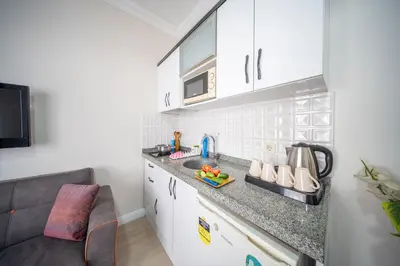 a kitchen with a sink and a counter top at Feyza Apart in Istanbul