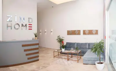 a living room with a couch and a table at Zin D Home Otel Alemdağ in Istanbul