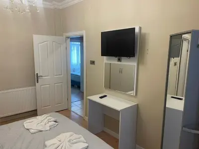 a room with a bed and a television on the wall at Blue Mosque Apart in Istanbul