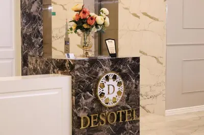 a welcome sign in a room with a vase of flowers at DES'OTEL in Tekirdag