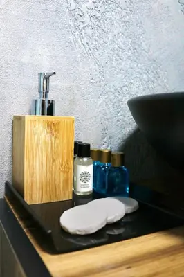 a counter with a sink and two bottles of soap at Insta Hotel Karakoy in Istanbul