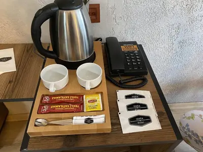 a table with a coffee pot and a telephone at Insta Hotel Karakoy in Istanbul