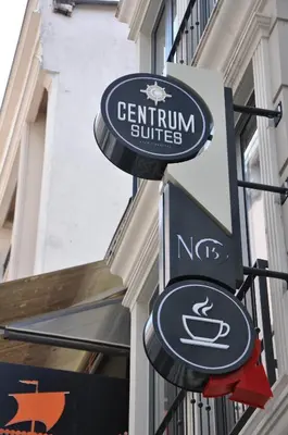 a sign for a centrum suites on the side of a building at Centrum Suites İstanbul in Istanbul