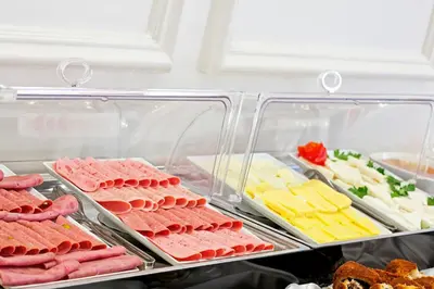 a display case with different types of meats and cheese at Aren Suites in Istanbul